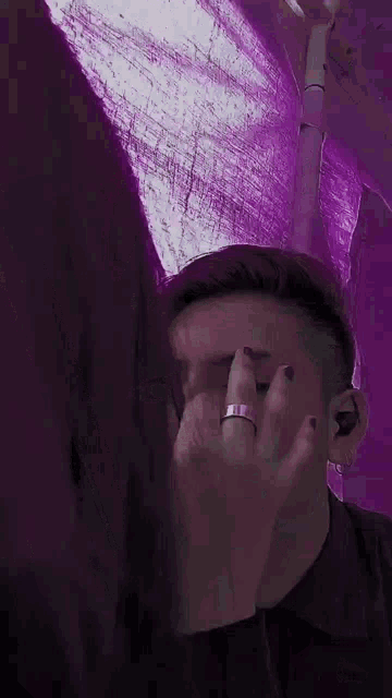a man with a silver ring on his finger