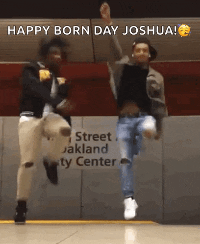 two men are jumping in the air in front of a sign that says " happy born day joshua "