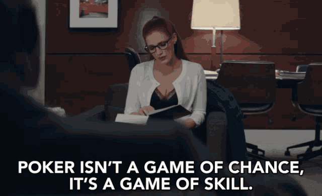 a woman is sitting in a chair reading a book with the words poker isn 't a game of chance