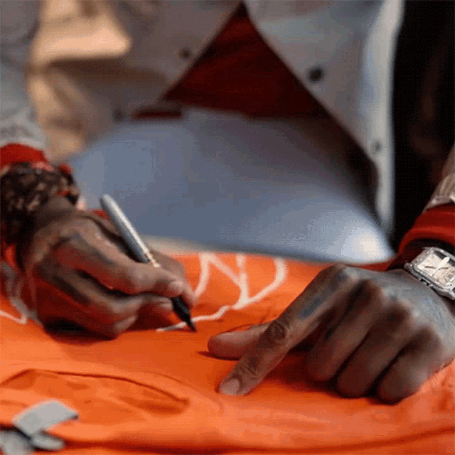 Autograph Kevin Gates GIF - Autograph Kevin Gates Signing GIFs