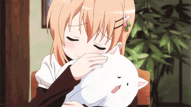 a girl is petting a white stuffed animal with her eyes closed