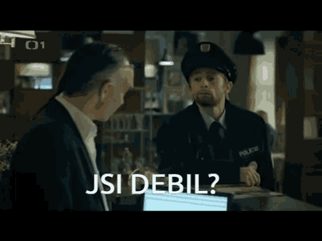 a man talking to a police officer with the words jsi debil