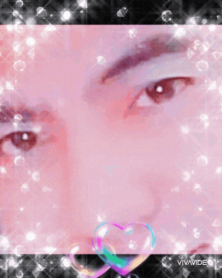 a close up of a person 's face with a heart in the corner