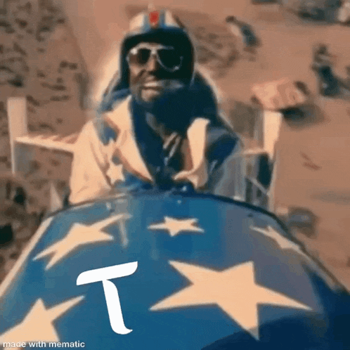 a man in a helmet and sunglasses is riding a blue sled with stars on it .