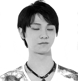 a man with his eyes closed wearing a necklace with roman numerals on it