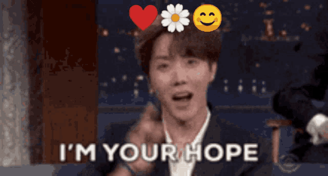 a man in a suit says " i 'm your hope " in front of a heart and smiley face