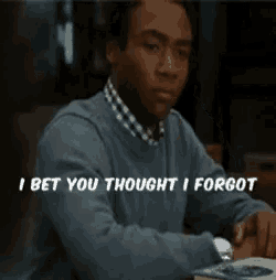 a man sitting at a table with the words " i bet you thought i forgot " on the bottom