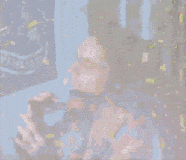 a man in a colorful shirt is surrounded by confetti while holding a glass of wine
