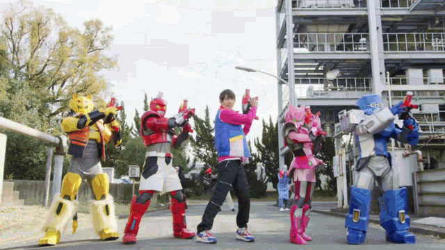 a group of robots are standing next to each other