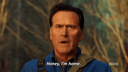 a man in a blue shirt is saying `` honey , i 'm home . ''