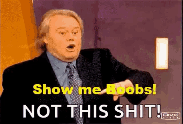 a man in a suit and tie is pointing at something and says show me boobs not this shit .