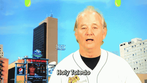 a baseball player says holy toledo in front of a city skyline
