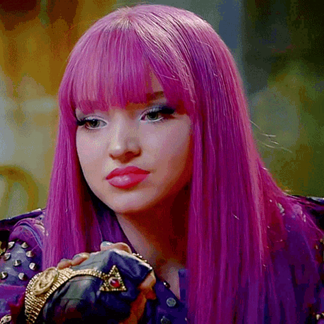 a close up of a woman with purple hair and a purple jacket
