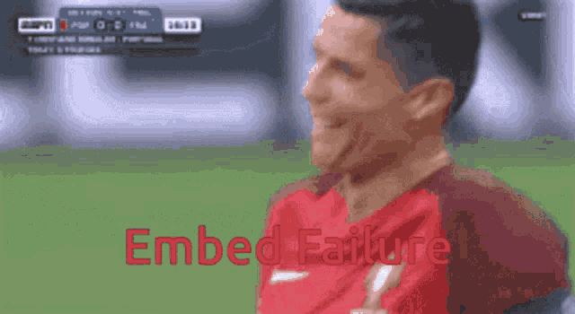 a blurry picture of a soccer player with the words embed failure on the bottom right