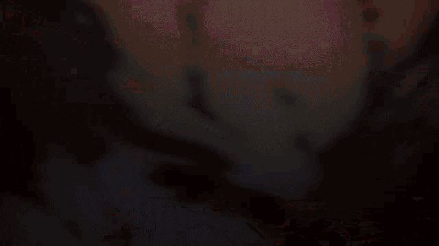 a person with a sword is surrounded by a glowing ring