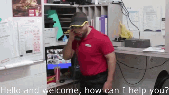 a man in a red shirt is talking on a cell phone with the words hello and welcome how can i help you