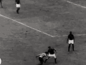 a group of men are playing a game of soccer on a field