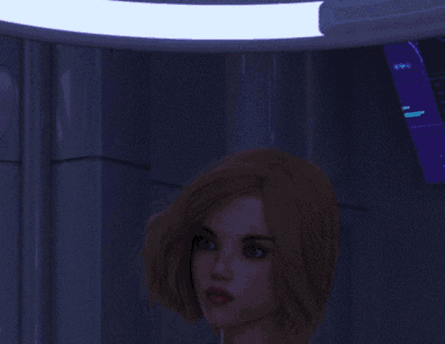 a woman with pink hair is standing in front of a screen that says 99.99