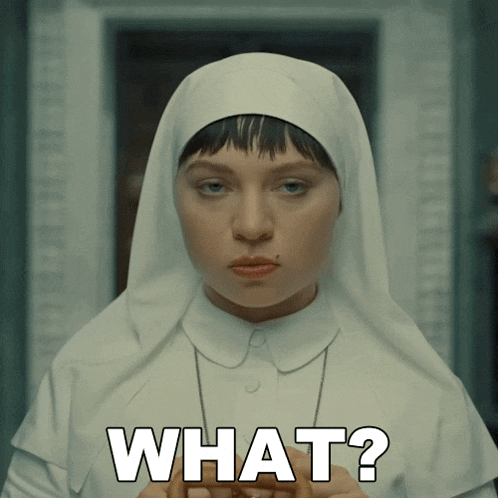 a woman in a nun 's outfit is asking the question " what "