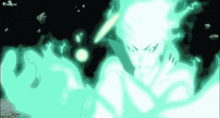 a man is standing in a dark room with a green flame coming out of his chest .