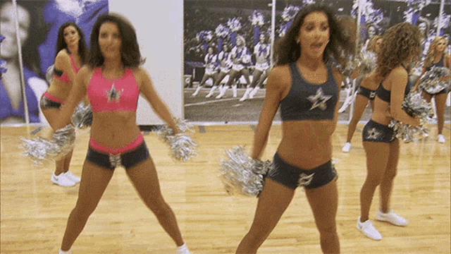 a group of cheerleaders are dancing in a gym wearing cowboys outfits
