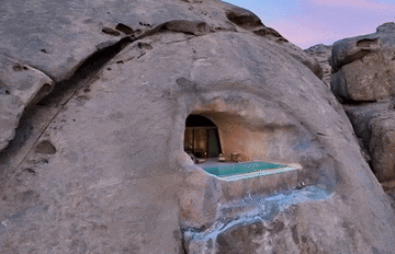 a cave with a swimming pool in it