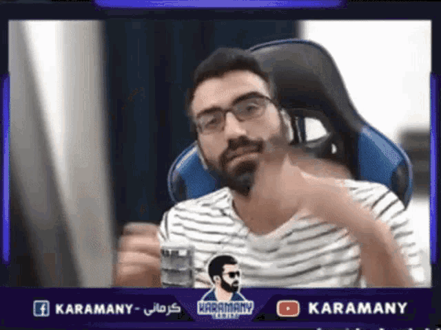 a man with glasses and a beard is sitting in a gaming chair with a facebook and youtube logo above him