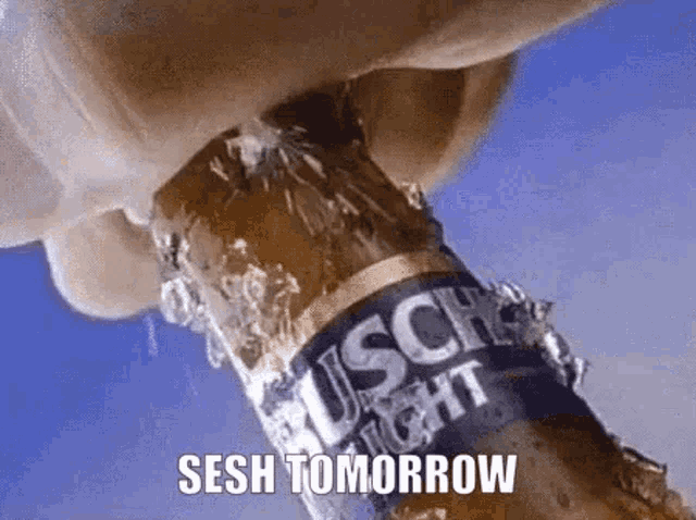 a person is opening a busch light beer bottle