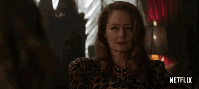 a woman in a leopard print dress is featured in a netflix ad