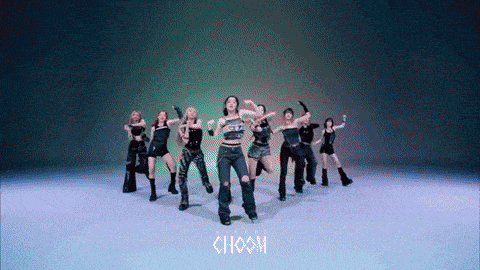 a group of women are dancing with the word choom in the background