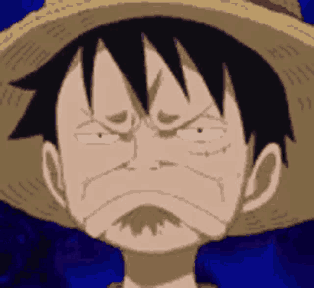 luffy from one piece is wearing a straw hat and making a sad face .