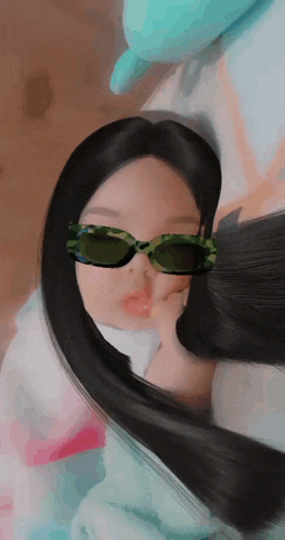 a woman with long black hair wearing sunglasses