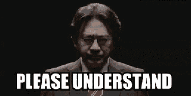 a man in a suit and tie is standing in front of a black background and saying `` please understand '' .