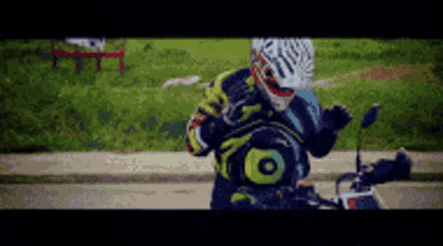 a man wearing a helmet and gloves is standing next to a motorcycle
