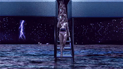 a woman in a bikini is walking down a staircase into the water