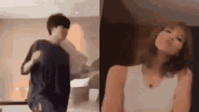 a man and a woman are dancing in a room . the woman is wearing a white tank top .