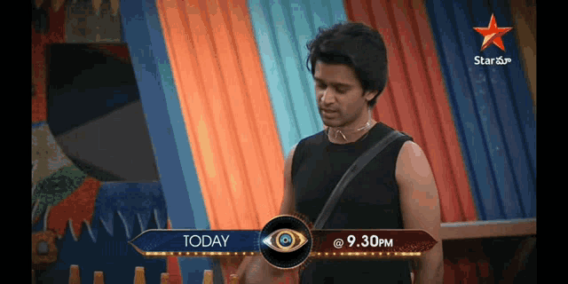 a man in a black tank top stands in front of a sign that says today at 9:30 pm