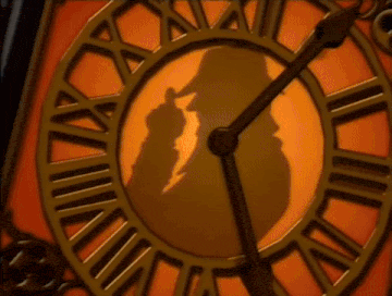 a clock with roman numerals on it is lit up
