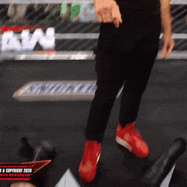 a blurred image of a person 's feet with a sign in the background that says awn