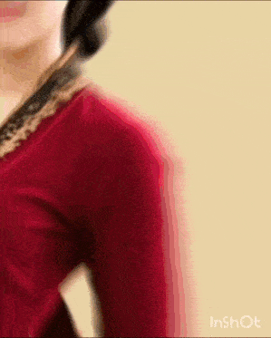 a blurry picture of a woman in a red dress