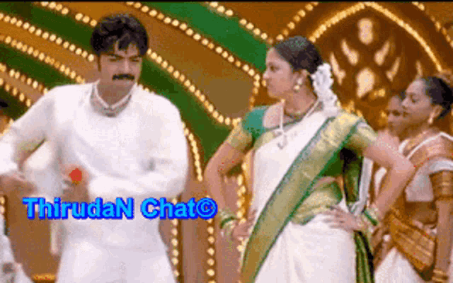 a man and a woman are dancing in front of a sign that says thiruda chat