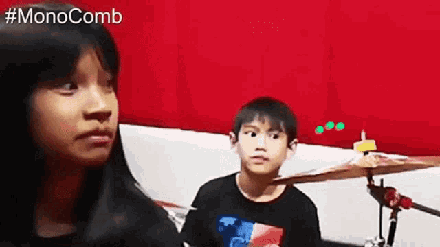 a girl and a boy are playing drums with the hashtag #monocomb on the bottom right