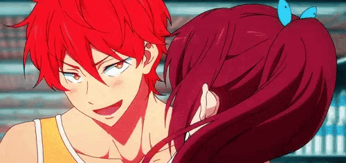 a boy with red hair and a girl with red hair are standing next to each other .
