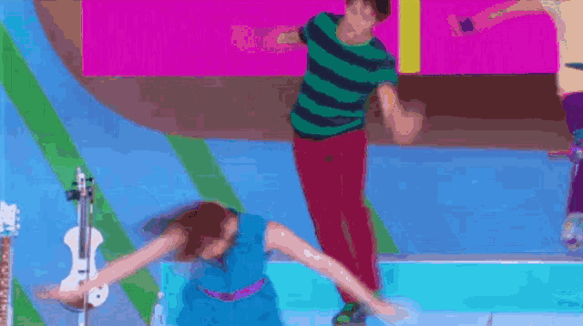 a man and a woman are dancing on a stage