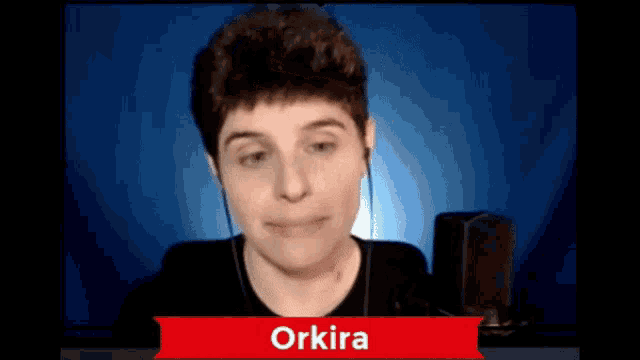 a person with the name orkira on a red sign