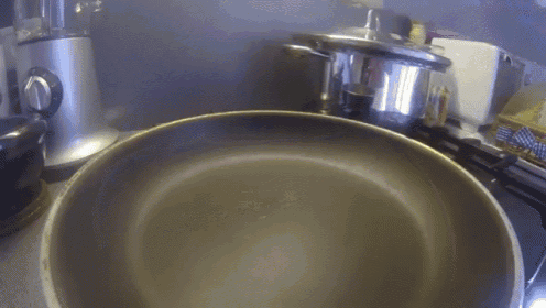 a pan filled with oil is on a stove top