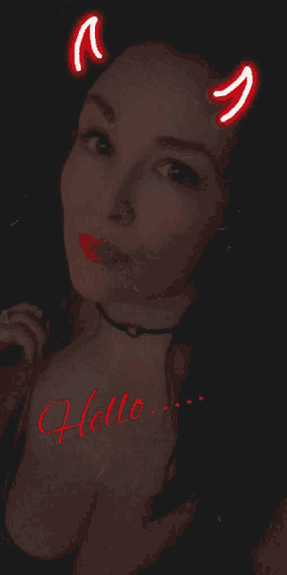 a woman with devil horns on her head says hello in red