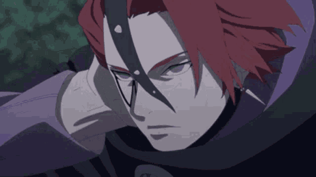 a close up of a person 's face with red hair and green eyes