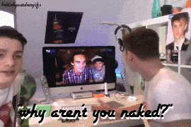 two boys are looking at a computer screen with the words " why aren t you naked "