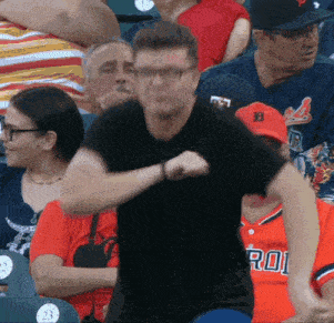 a man in a black t-shirt with the letter d on it